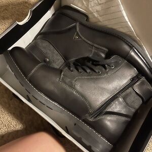 Men’s size 13 black boot, brand new in box.